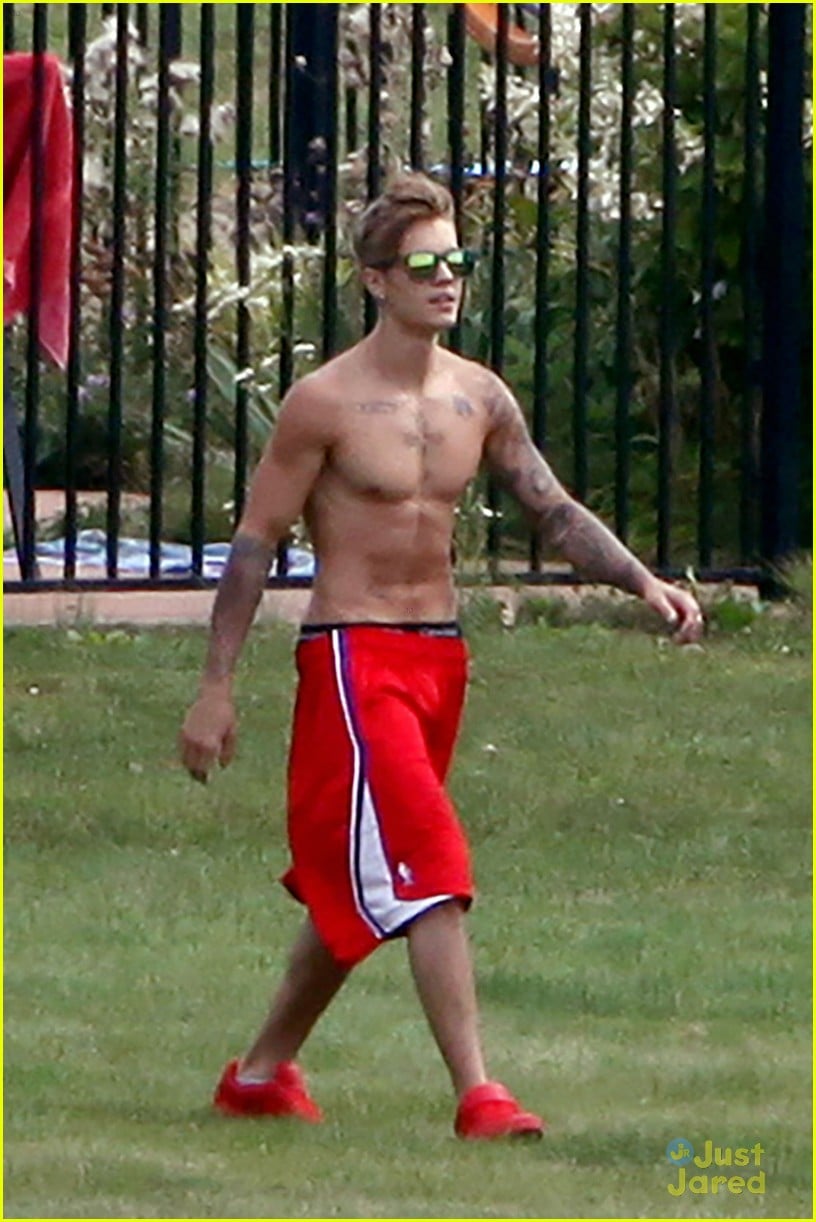 Shirtless Justin Bieber Lounges At The Pool With Bikini Clad Girl