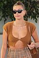 hailey bieber shows off fit figure in crop top sweater plaid pants 01