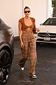 hailey bieber shows off fit figure in crop top sweater plaid pants 03
