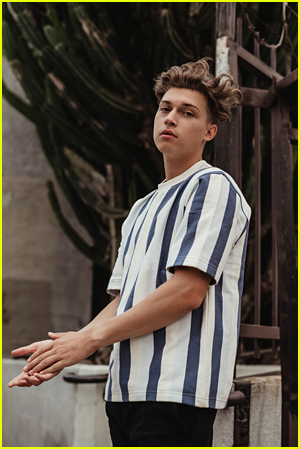 Ricky Garcia wears a striped shirt by Sheri Angeles