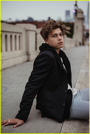 Ricky Garcia sits on a bridge by Sheri Angeles