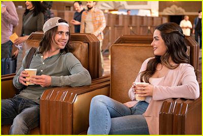 Tanner Buchanan sports long hair and a backwards cap, while Addison Rae wears a pink top while sitting in chairs at Union Station