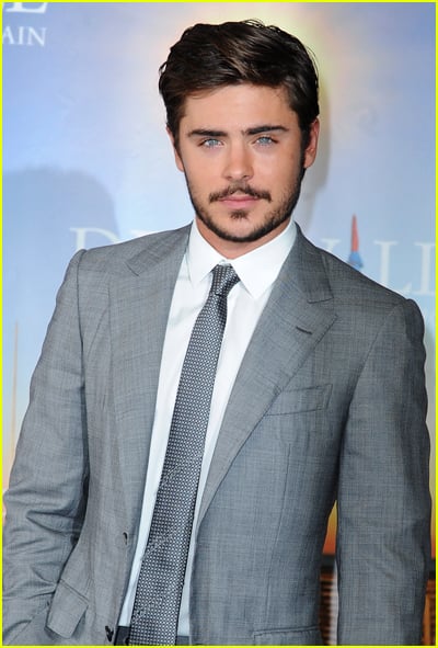 Zac Efron wears a grey suit to a movie premiere