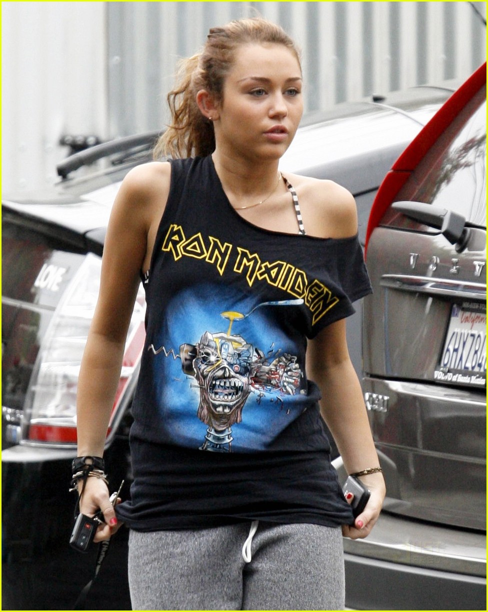 Miley Cyrus rocks the "one pant leg up" look after working out at...