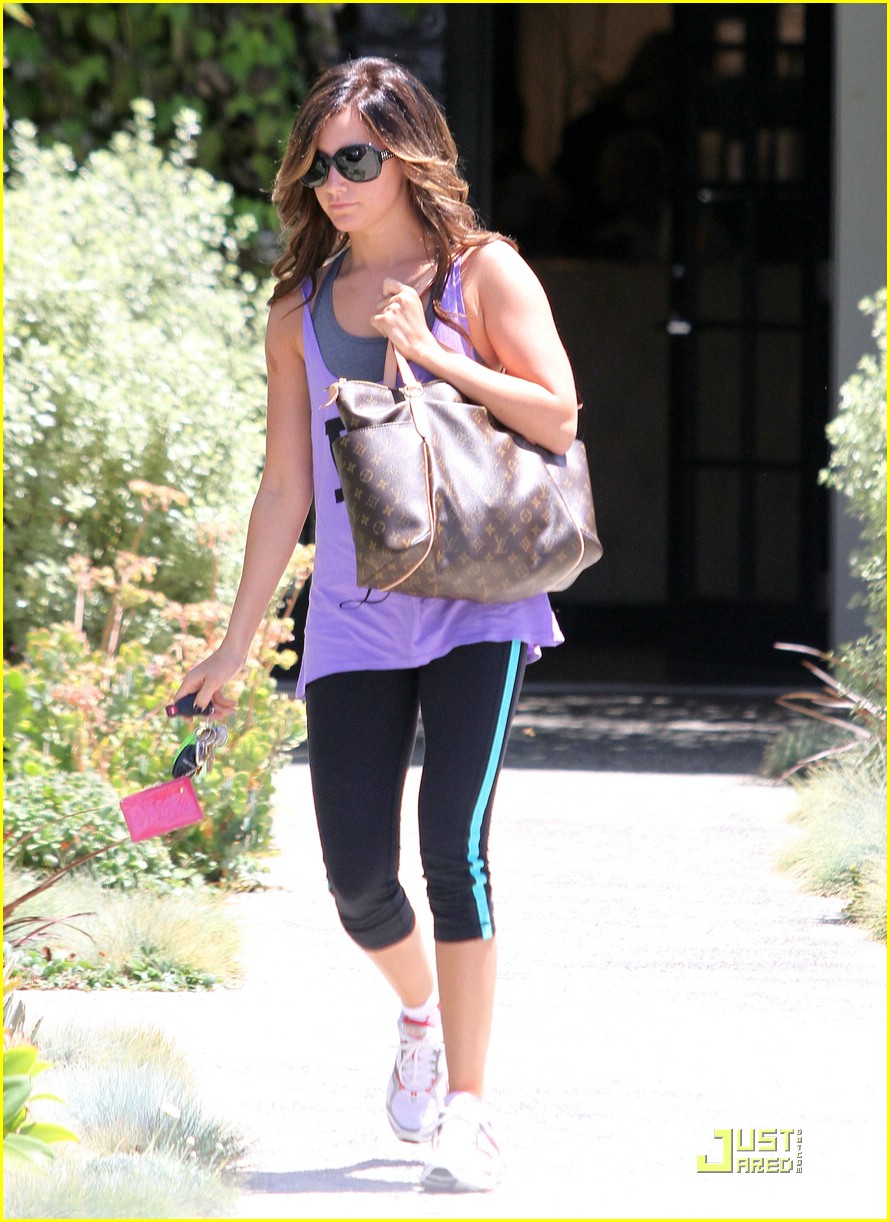Ashley Tisdale wearing Louis Vuitton Multipli Cite Bag, Mystique Gold  Gladiator T-Strap Sandal and Hollister Vintage Wa…