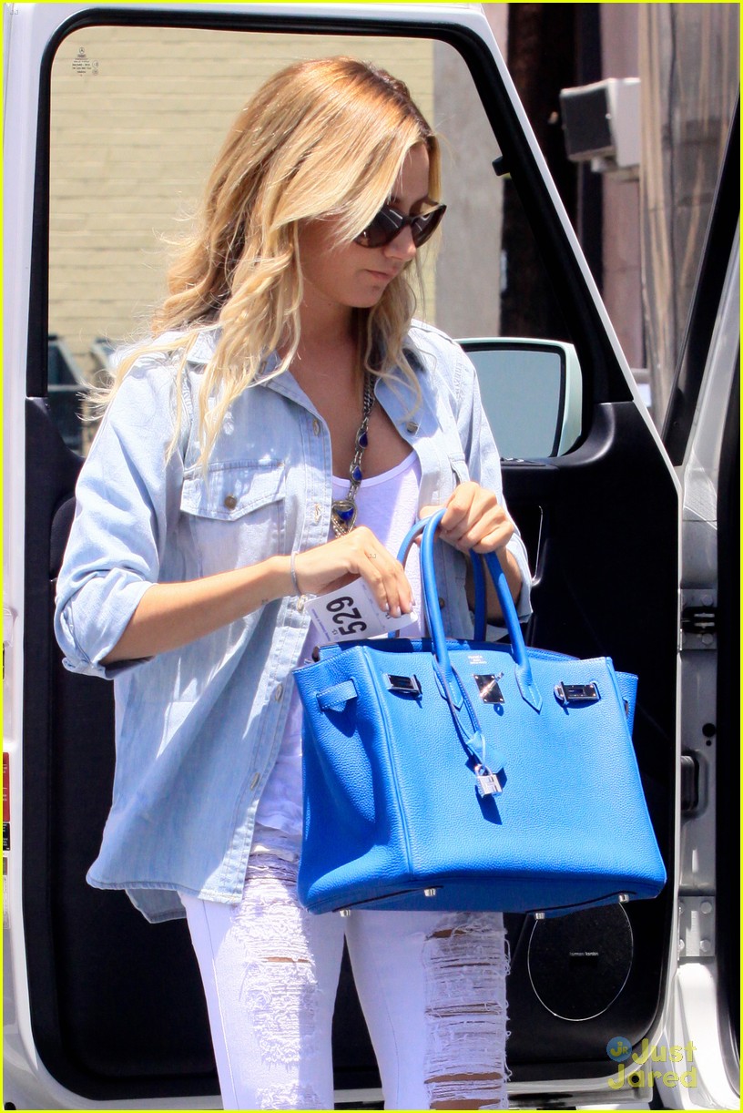 Ashley Tisdale Sky Blue Hermes Birkin with ripped white jeans and