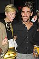 miley cyrus holds hands with nicole schzeringer london 01