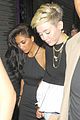 miley cyrus holds hands with nicole schzeringer london 06