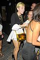 miley cyrus holds hands with nicole schzeringer london 08