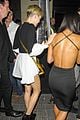 miley cyrus holds hands with nicole schzeringer london 09