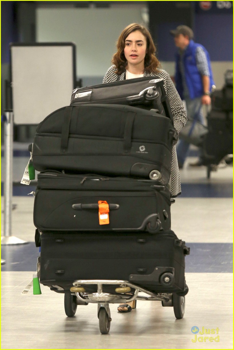 Lily Collins Arrives at LAX with a New Prada Bag - PurseBlog