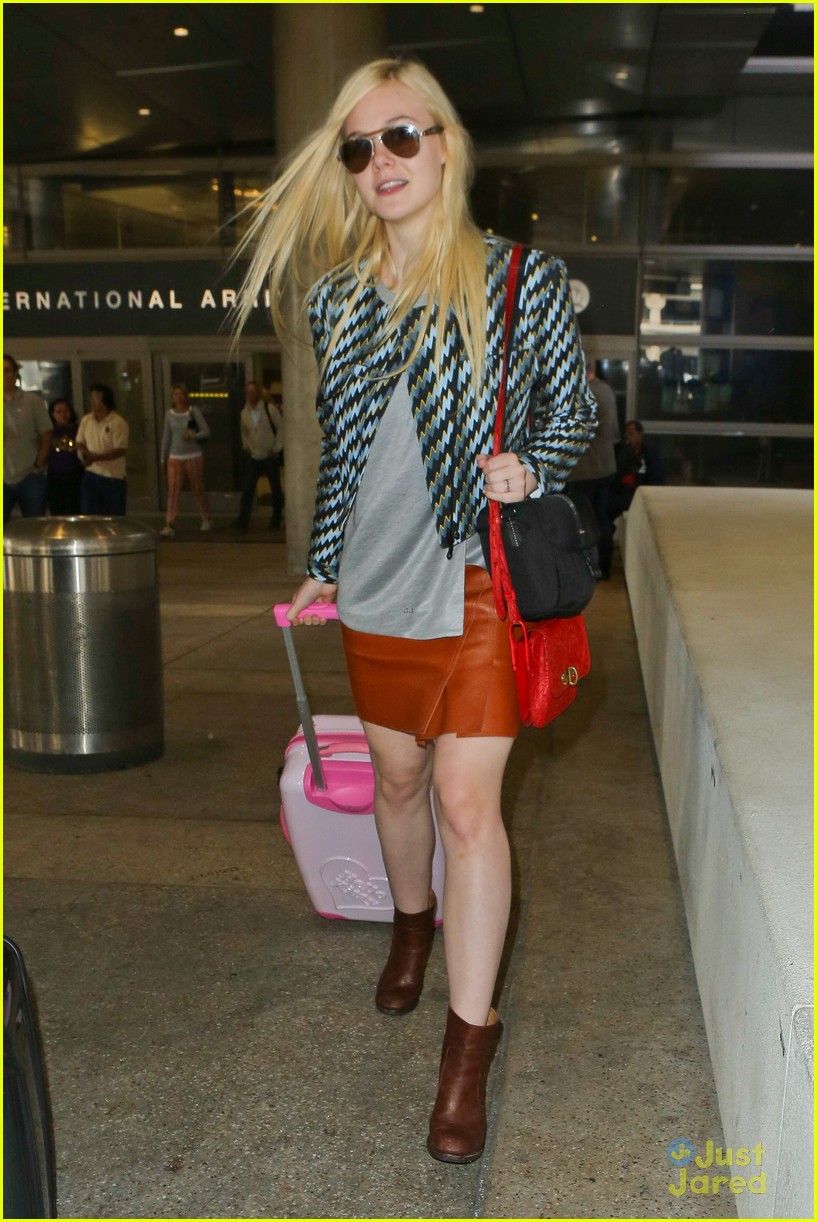 Full Sized Photo of dakota elle fanning separate airport landings 10