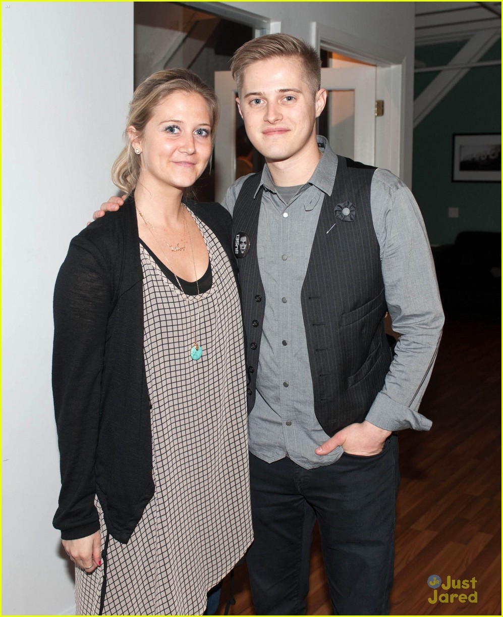 Lucas Grabeel poses with longtime girlfriend Emily Morris inside the screen...