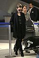 lily collins arrives lax after quick trip 02