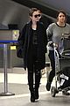lily collins arrives lax after quick trip 05