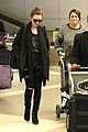 lily collins arrives lax after quick trip 09