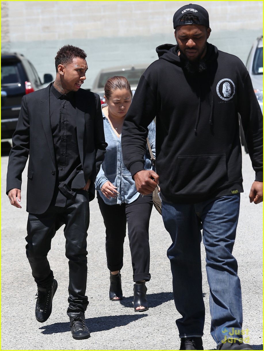 Kylie Jenner & Tyga Coordinate Their Black Outfits at LAX Airport