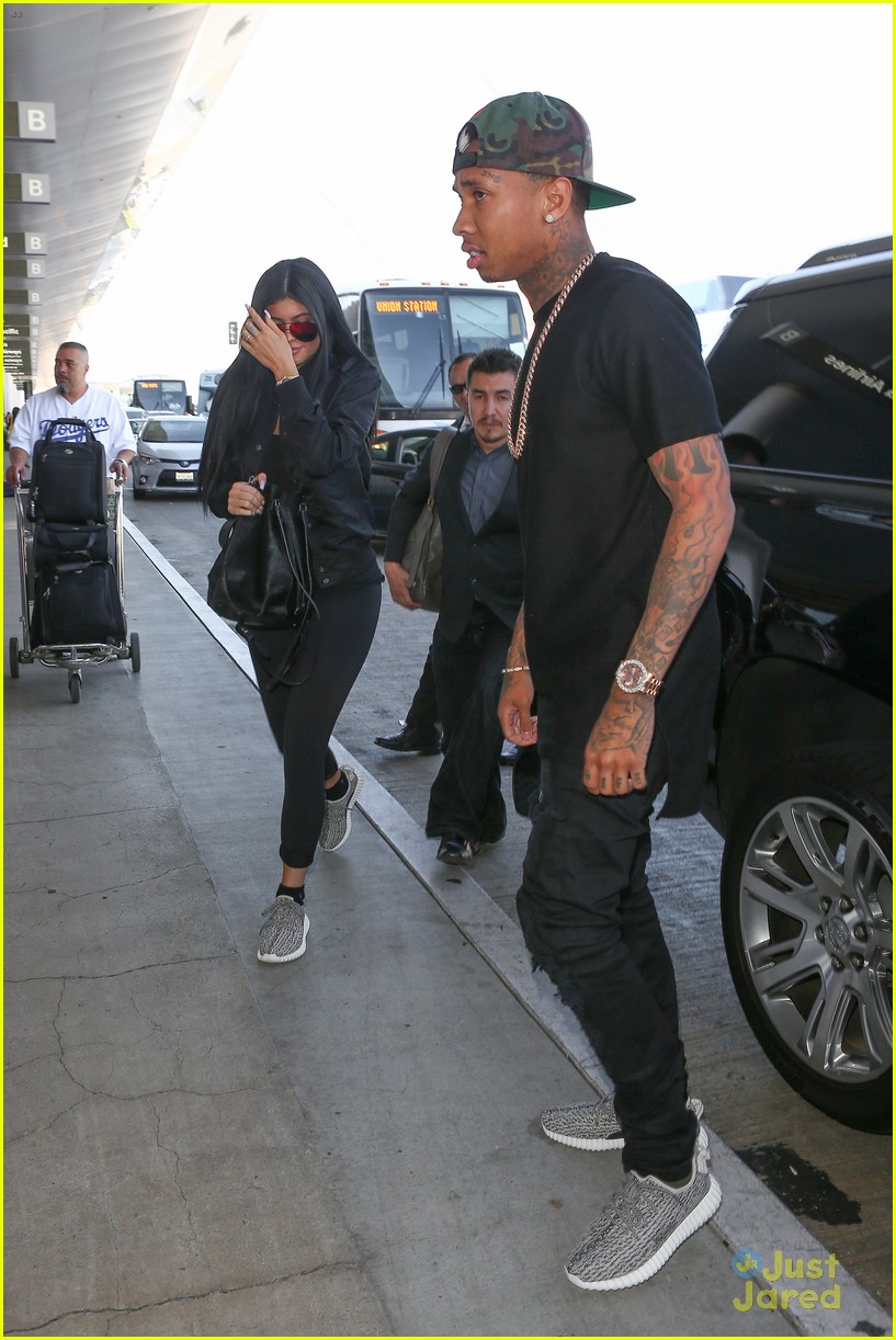 Kylie Jenner & Tyga Coordinate Their Black Outfits at LAX Airport