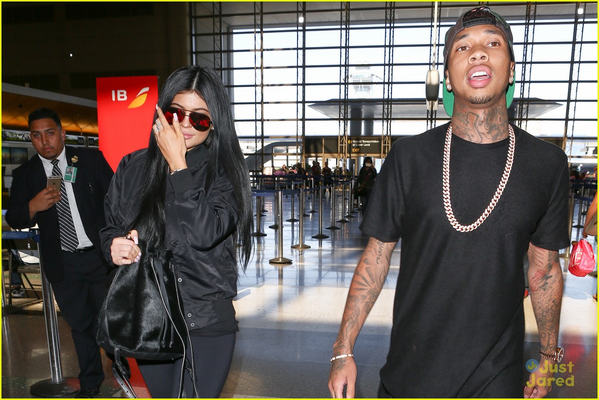 Kylie Jenner & Tyga Coordinate Their Black Outfits at LAX Airport