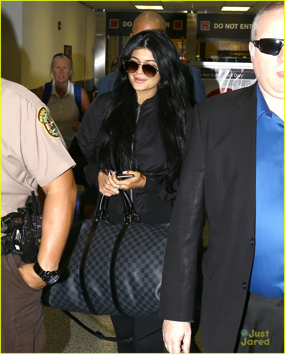 Kylie jenner arrives at miami international airport hi-res stock