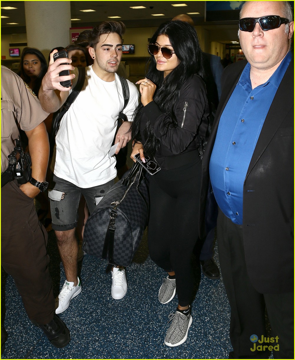 Kylie jenner arrives at miami international airport hi-res stock