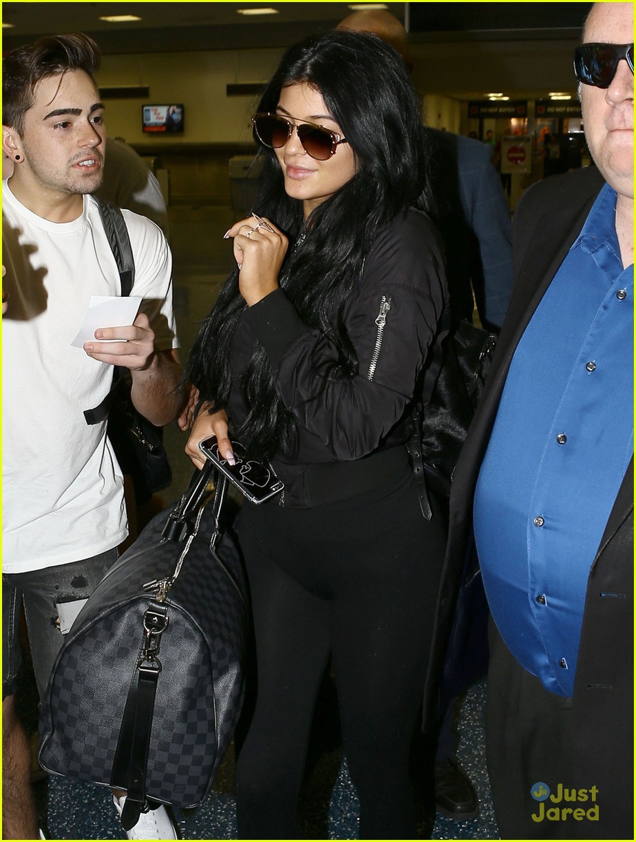 Kylie jenner arrives at miami international airport hi-res stock