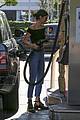 kendall jenner bares midriff in a crop top while getting gas 16