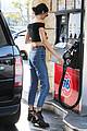 kendall jenner bares midriff in a crop top while getting gas 38