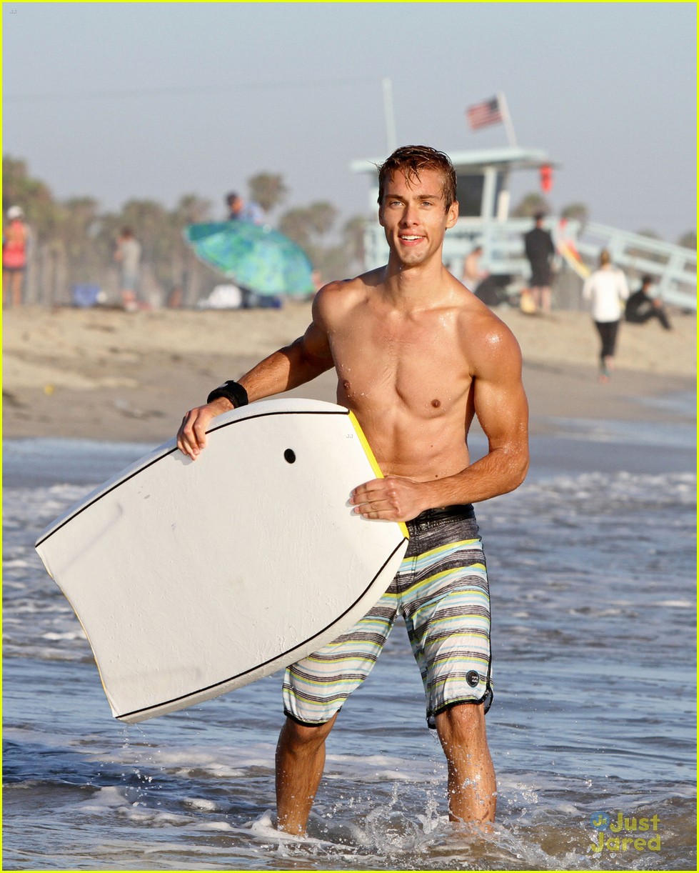 Shirtless Austin North Gets Wiped Out by Waves While Boogie Boarding ...