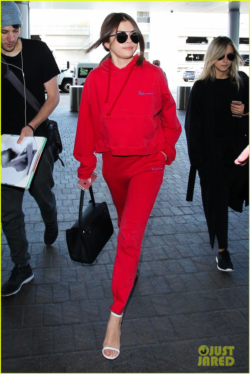 Full Sized Photo of selena gomez red sweat suit lax 03 | Selena Gomez