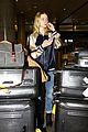 elle fanning lax airport with lots of luggage 01