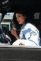 kylie jenner opens her car door to let a fan take a selfie 04