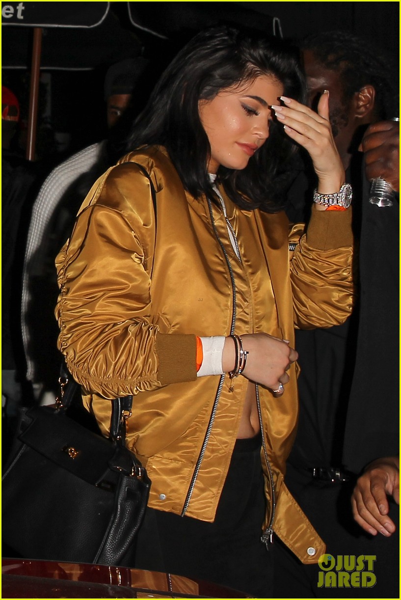 Kylie Jenner Wears a Gold Bomber Jacket Out With French Montana