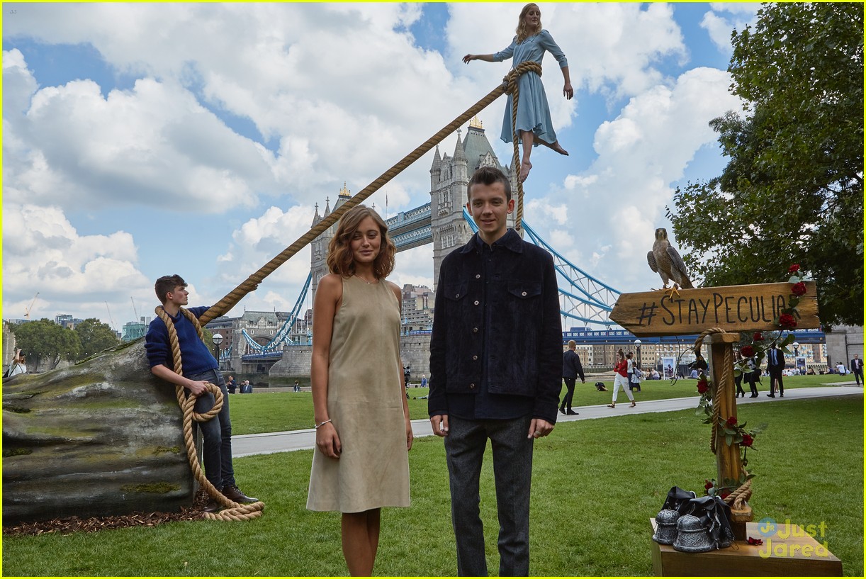 Asa Butterfield and Ella Purnell hang onto a rope during the Miss Peregrine...
