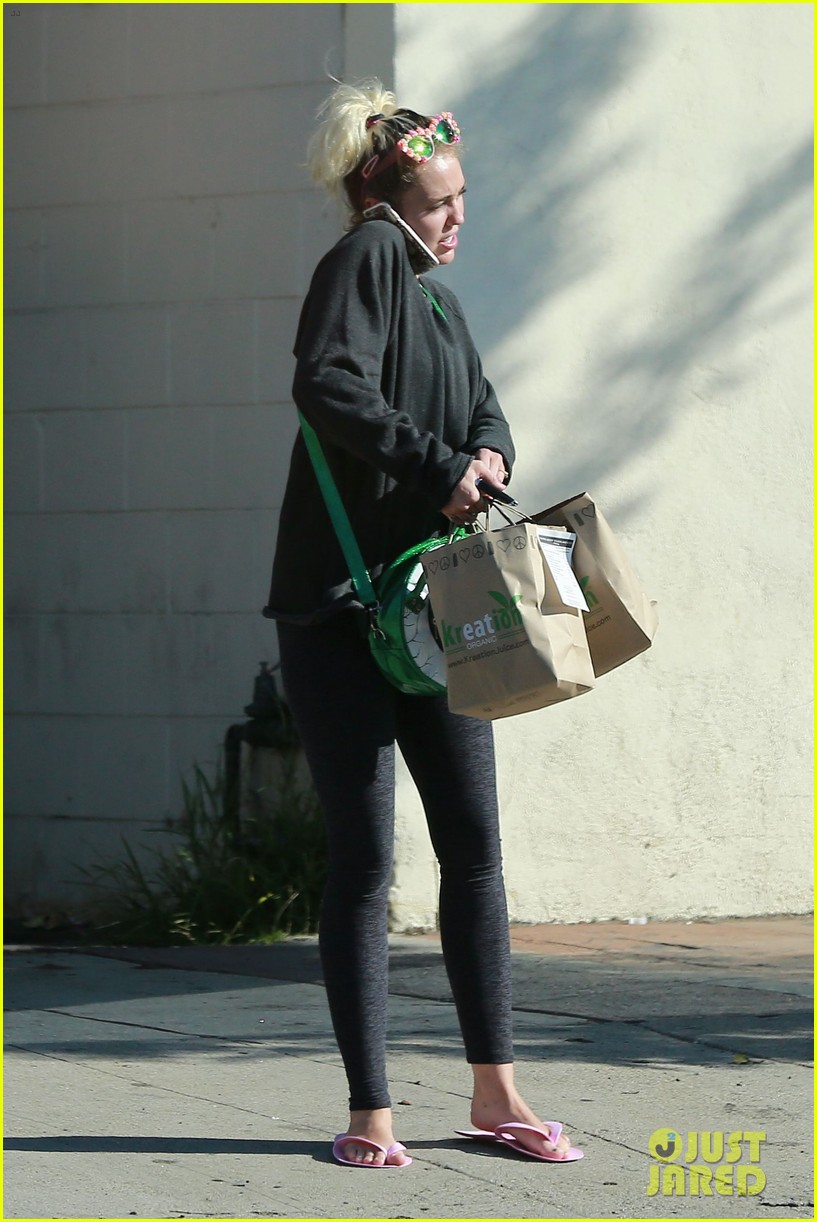 Miley Cyrus Wears Only a Sports Bra While Getting a Mani-Pedi | Photo ...