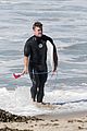 liam hemsworth goes for monday morning surf session with brother luke 05