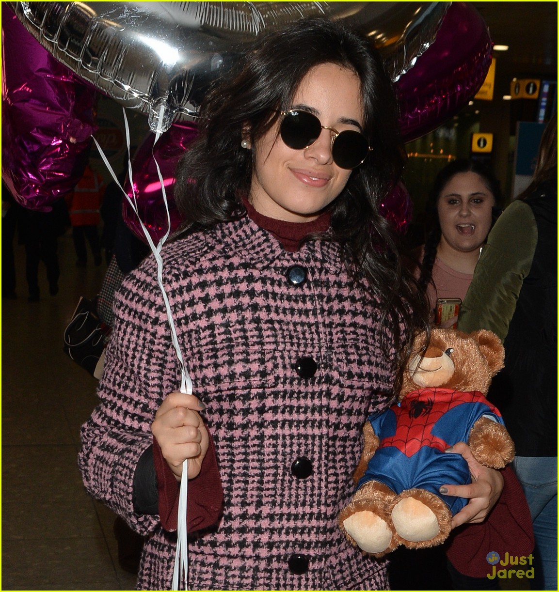 Full Sized Photo of camila cabello bear balloons heathrow airport 03