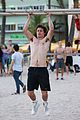 ansel elgort goes shirtless for a workout at the beach 03