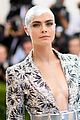 cara covers her bald head with crystals at met02