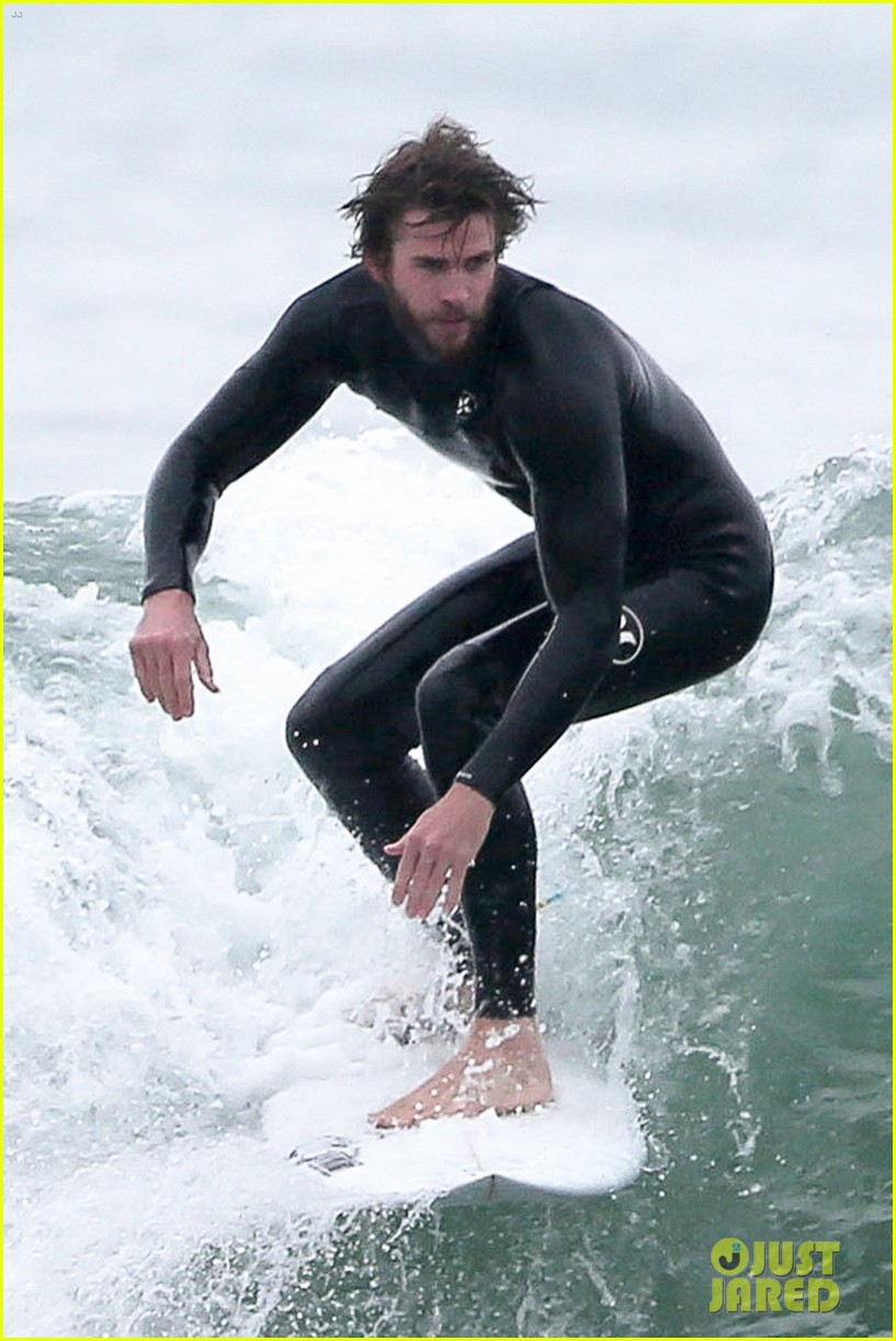 Full Sized Photo of liam hemsworth hits the waves to kick off weekend ...