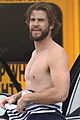 liam hemsworth strips out of wetsuit to reveal ripped abs 02
