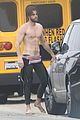 liam hemsworth strips out of wetsuit to reveal ripped abs 03