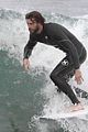 liam hemsworth strips out of wetsuit to reveal ripped abs 04