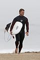 liam hemsworth strips out of wetsuit to reveal ripped abs 07