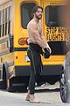 liam hemsworth strips out of wetsuit to reveal ripped abs 09