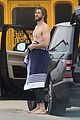liam hemsworth strips out of wetsuit to reveal ripped abs 29