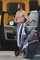 liam hemsworth strips out of wetsuit to reveal ripped abs 46