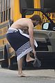 liam hemsworth strips out of wetsuit to reveal ripped abs 51