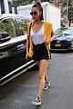 bella hadid rocks white bodysuit and yellow hoodie in nyc 01