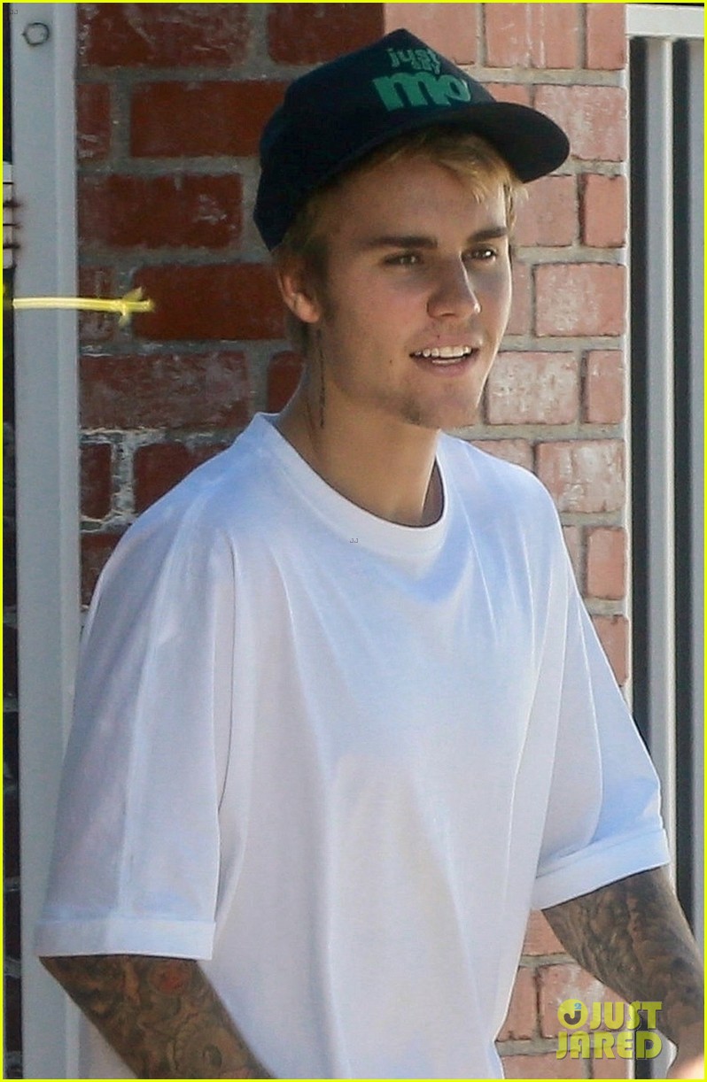 Justin Bieber Goes Shirtless And Flashes His Abs During Walk Around La